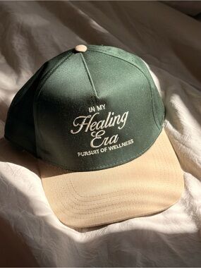 BLOOM’s MARI LUELLEN PERSUIT OF WELLNESS Healing Era TRUCKER HAT